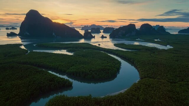 Hyperlapse aerial view drone flying over mangrove forest and mountain peak at sunrise, Phang nga bay, Thailand
