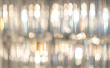 Blur golden bokeh background of blurry luxury crystal ball chandelier for reflective glittering light from Christmas holiday party - obrazy, fototapety, plakaty