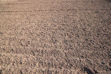 Brown crushed soil peat field abstract texture may be used as a  background wallpaper