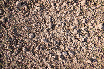 Brown crushed soil peat field abstract texture may be used as a  background wallpaper