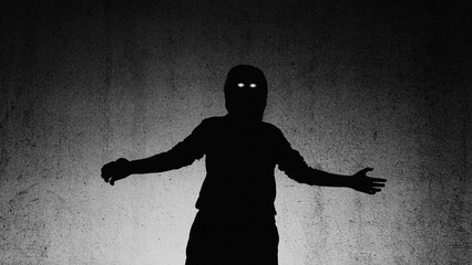 Looking up with a low camera angle of a silhouette of a scary horror figure with glowing eyes. With...