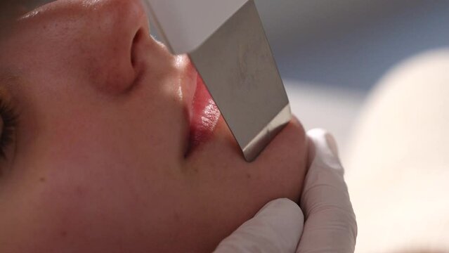 Ultrasonic cleaning of the skin of the face.