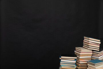 learning literacy science education stack of books on a black background