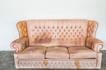Brown soft leather luxurious sofa in living room.mock up interior in classic style, modern interior design concept.