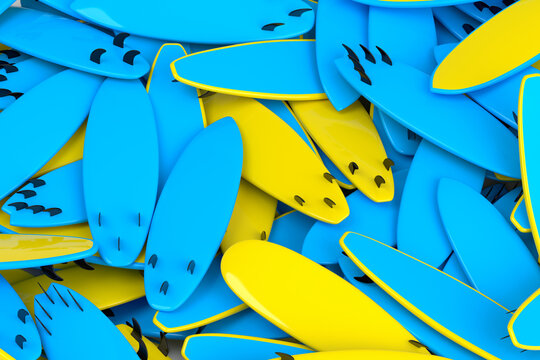 Pile of surfboard for summer surfing isolated on blue background.