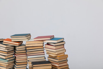science education stack of books on white background teaching literacy