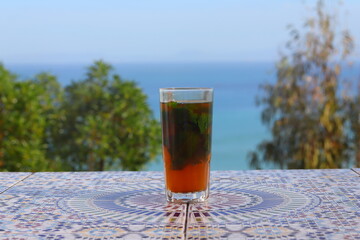 A cup of Moroccan mint tea with a sea view at Haffa Café