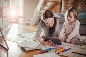 Mother and Daughter Enjoying Drawing Together at Home