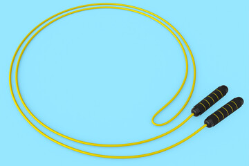 Yellow skipping rope or jumping rope isolated on blue background.
