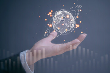 holding globe holographic to show ideas to export and logistic around the world by discovery,...