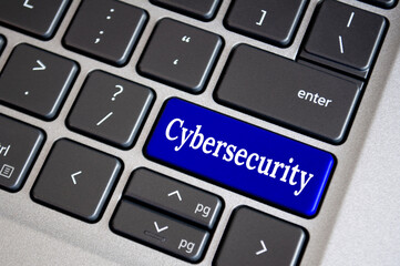 Cybersecurity text on blue keyboard. Secure access for online privacy and personal data protection