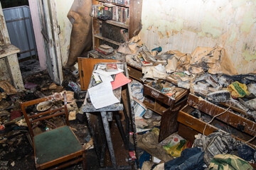 Consequences after a short circuit, burnt house interior, damaged apartment after fire, burned...