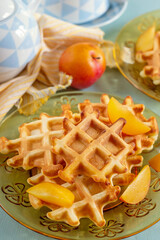 Sweet fluffy classic waffles served with plums - 676831199