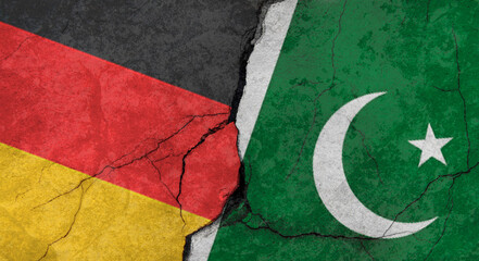 Germany and Pakistan flags, concrete wall texture with cracks, orange background, military conflict concept