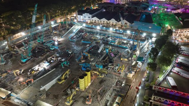 night illumination singapore city center working construction yard aerial panorama 4k timelapse