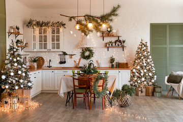 Modern Kitchen Interior with Island, Sink, Cabinets in New Luxury Home Decorated in Christmas Style.