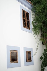 Building facade with window shutters