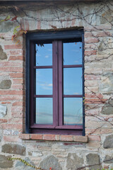DETAIL OF AN ANCIENT HOUSE IN TUSCANY