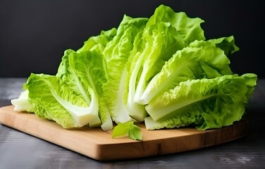 fresh lettuce vegetables cut raw on wooden plate on white table for cooking