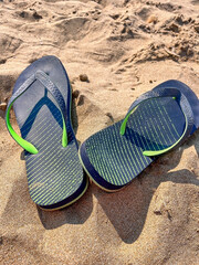 Fototapeta na wymiar Sandals in the sand