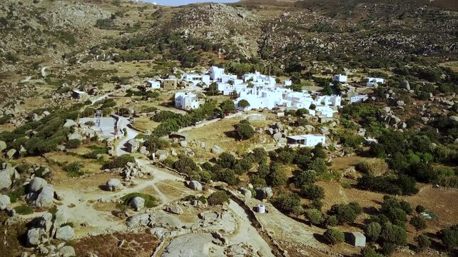 Drone footage of Volax mountain village on the Volax Plateau on a sunny day in Tinos island, Greece