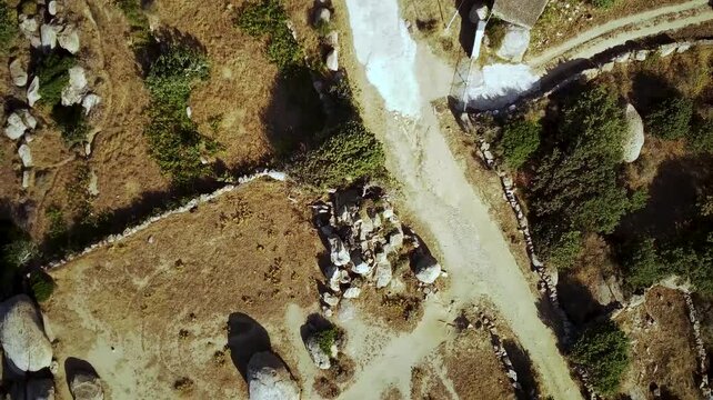 Bird's-eye footage of the public playground and granite boulders on Volax Plateau in Tinos, Greece
