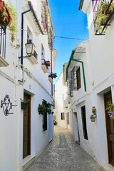 Fototapeta na wymiar Vertical shot of the Spanish village with urban white buildings