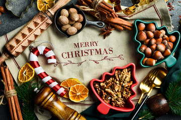 Christmas festive baking background. The inscription Merry Christmas. A set of spices, utensils and spices.