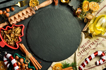 Christmas festive baking background. The inscription Merry Christmas. A set of spices, utensils and...