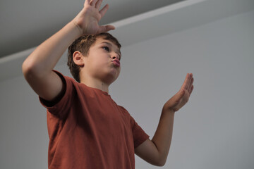 A child's raised hands in enthusiasm. Mirrors the effectiveness of positive reinforcement in education.