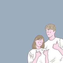 A couple (a man and a woman) posing and doing thumb up pose together on a light blue background