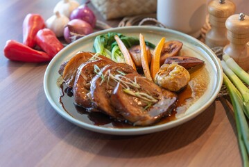 Top view of cooked meal with meat and vegetables on the plate