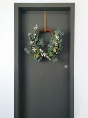 Christmas wreath hanging on front door