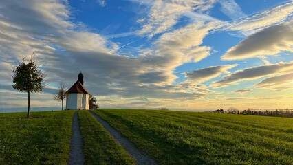 Haldenberg chapel under a cloudy sunset sky in Friedrichshafen, Germany.
