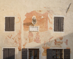 The frescoes on a medieval palace in Portobuffolè, Italy