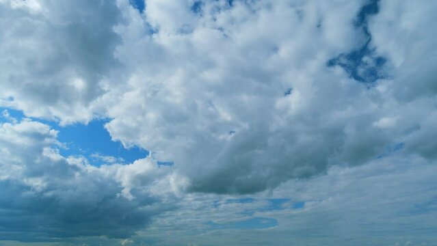 Layers Of Different Cloud Types With Blue Skies Cloudscape Background. Water Vapor Condense To Form Huge Cloud. Timelapse.