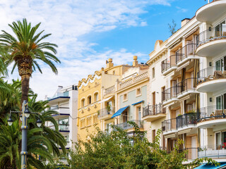 Beautiful architecture, residential buildings and palm trees in a tourist city Sitges, Catalonia,...