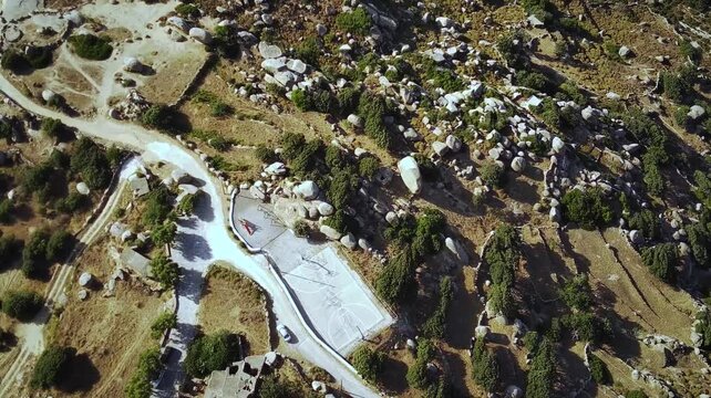 Top down drown footage over the public playground on Volax Plateau in Tinos Island, Greece