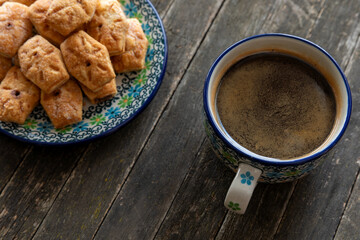Italian sweet snack biscuit cookies with a cup of coffee.