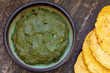 Pureed mustard greens with roti bread.