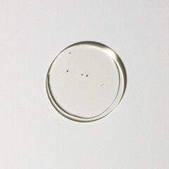 drop of transparent serum, cosmetic textures, skincare product smudge face serum, oil, cleanser