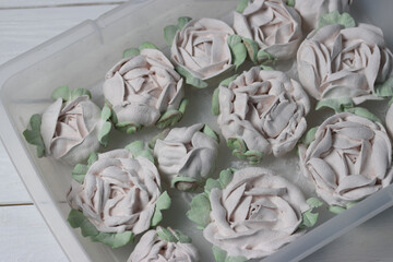 Safir flower. Homemade marshmallows. In a transparent tray. Photographed from above. Close-up.