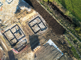 Drone top down view of new housing foundations seen at a controversial housing development in East Anglia, UK.