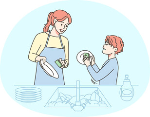 Smiling kid helping mom with dishes
