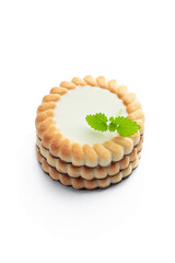 Stack of cream filling biscuits isolated on white