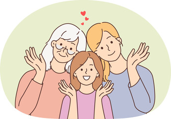 Smiling three generations of women posing together