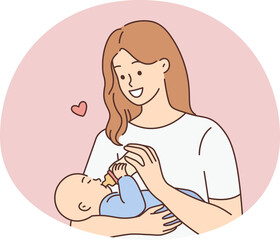 Happy woman feeding infant