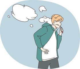 Young man smoking vaper outdoors