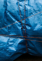 Blue crumpled synthetic fabric.