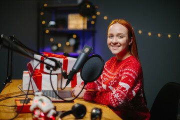 A girl blogger is doing a Christmas giveaway on her channel. Portrait of a girl in a Christmas...